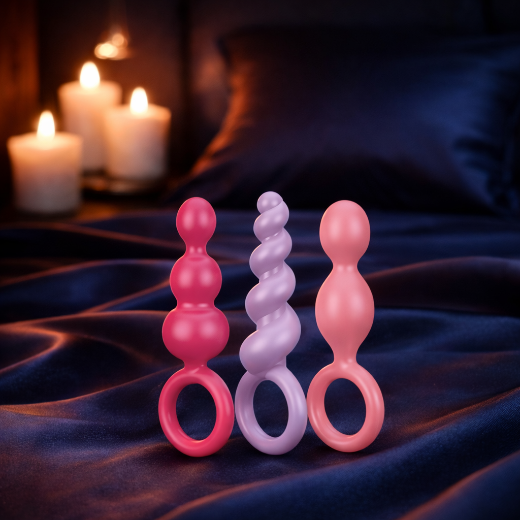 Bare Intentions Booty Call Plug Set with five colorful silicone anal plugs in various sizes, suitable for beginner to advanced users.