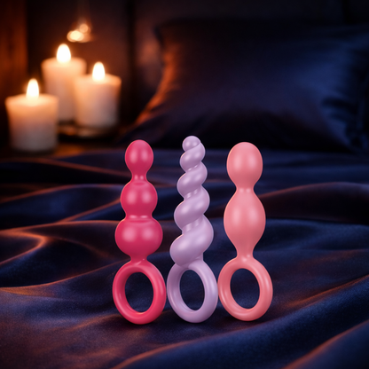 Bare Intentions Booty Call Plug Set with five colorful silicone anal plugs in various sizes, suitable for beginner to advanced users.