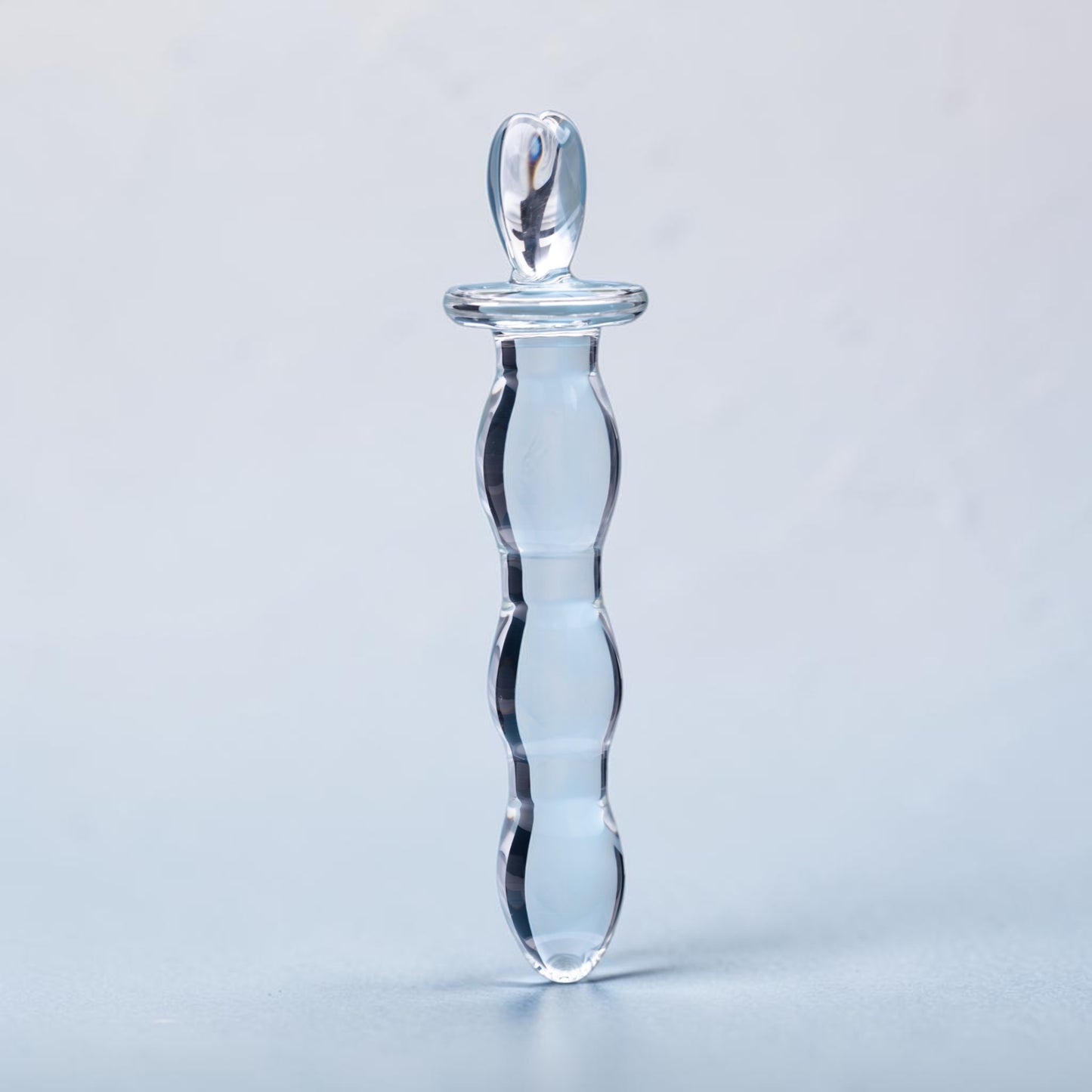 Bare Intentions Hera's Cascade jewelry piece featuring cascading silver chains and intricate design details.