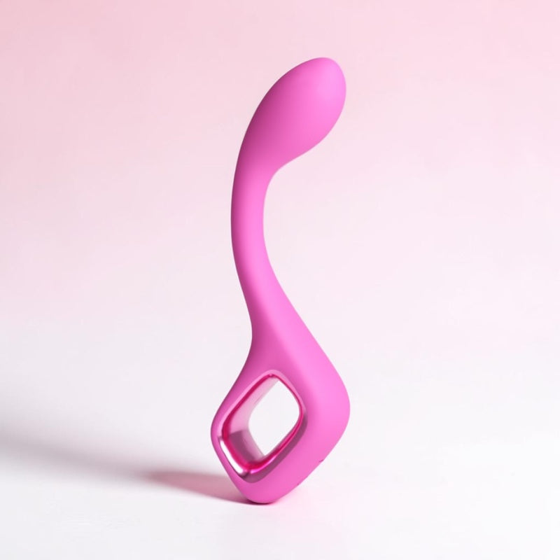 Bare Intentions Pretty in Pink Lace Curve G-Spot Vibrator with textured pink lace exterior and curved shape for targeted pleasure.