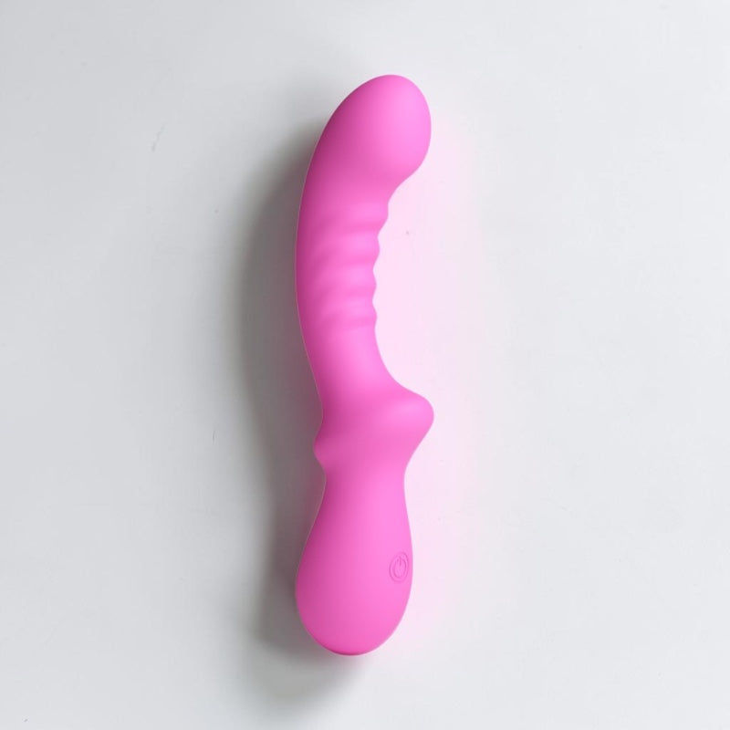 Pink G-spot vibrator from Bare Intentions, featuring a sleek design and smooth surface for targeted pleasure.
