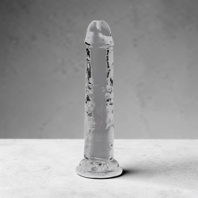 Clear 6-inch crystal from Bare Intentions, showcasing its transparent, polished surface and elegant shape.