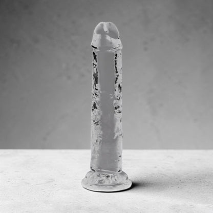 Clear 6-inch crystal from Bare Intentions, showcasing its transparent, polished surface and elegant shape.