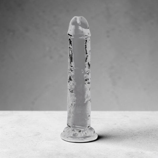 Clear 6-inch crystal from Bare Intentions, showcasing its transparent, polished surface and elegant shape.