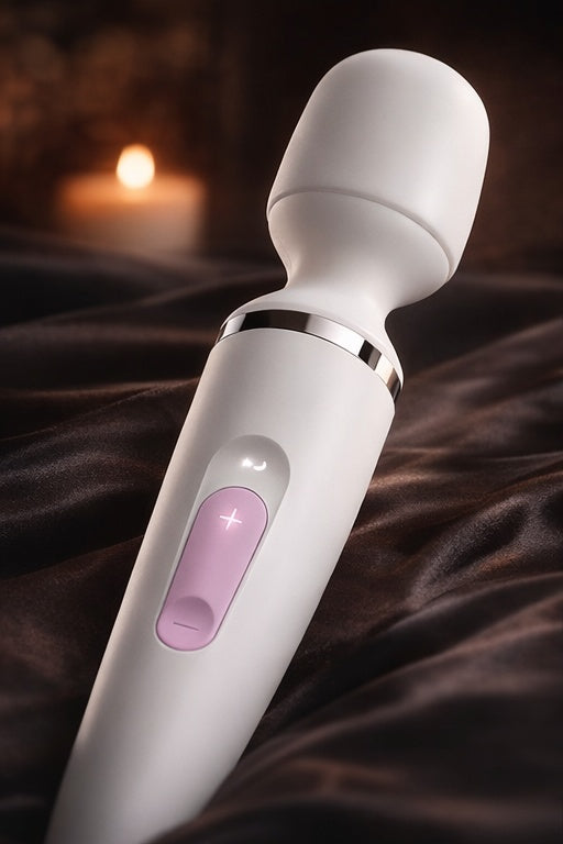 Bare Intentions Signature Wand lying on a wooden surface, showcasing its sleek design and natural finish.